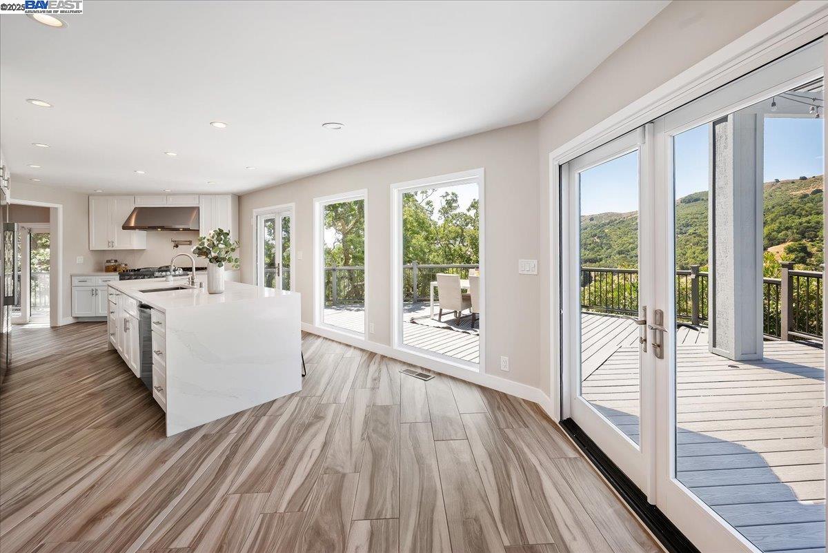 325 Bollinger Estates Court San Ramon, CA 94583 - Photo 15 of 59 a living room with stainless steel appliances kitchen island hardwood floor and a large window