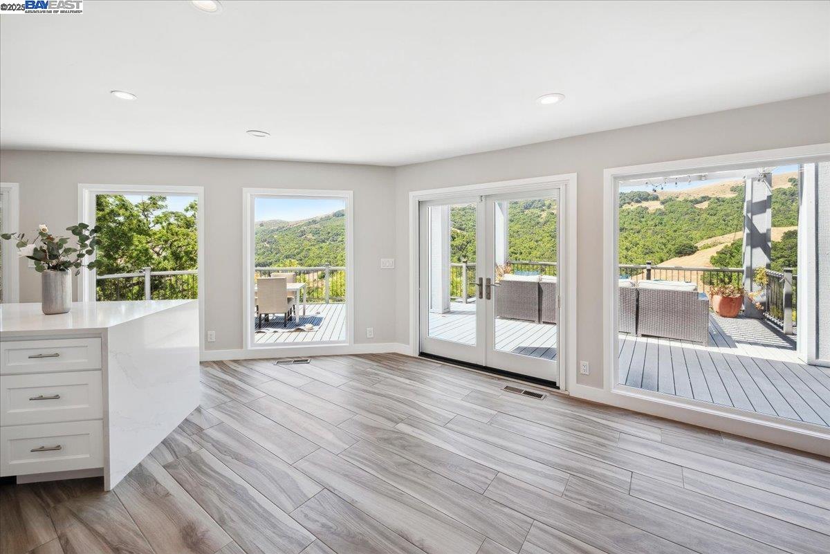 325 Bollinger Estates Court San Ramon, CA 94583 - Photo 16 of 59 a view of an empty room with wooden floor and a window