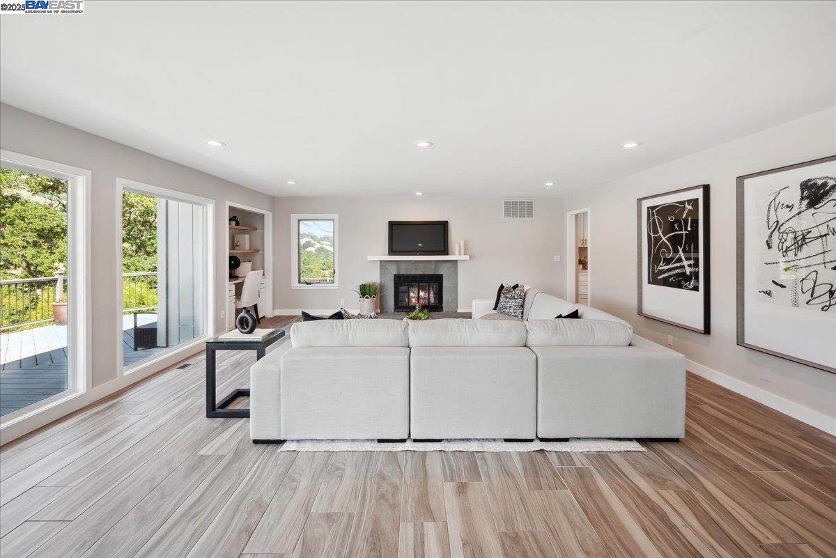 325 Bollinger Estates Court San Ramon, CA 94583 - Photo 17 of 59 a living room with furniture a large window and a fireplace