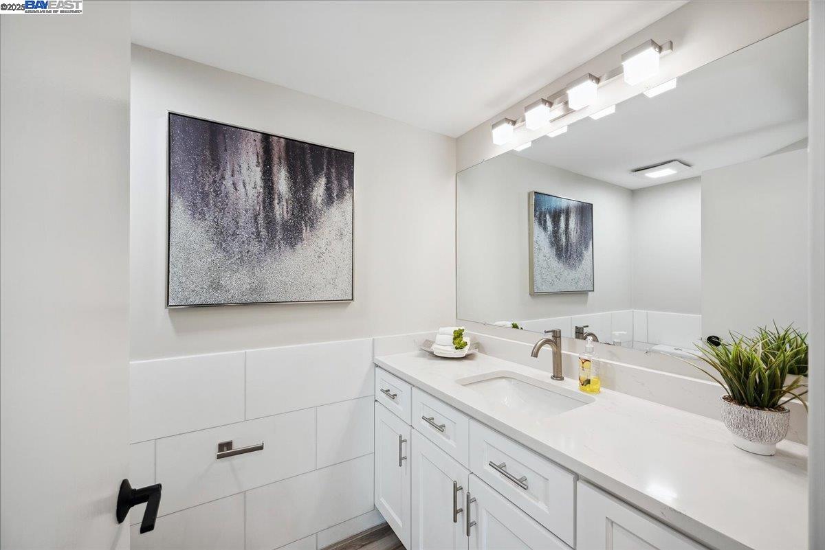 325 Bollinger Estates Court San Ramon, CA 94583 - Photo 22 of 59 a bathroom with a sink a mirror and vanity