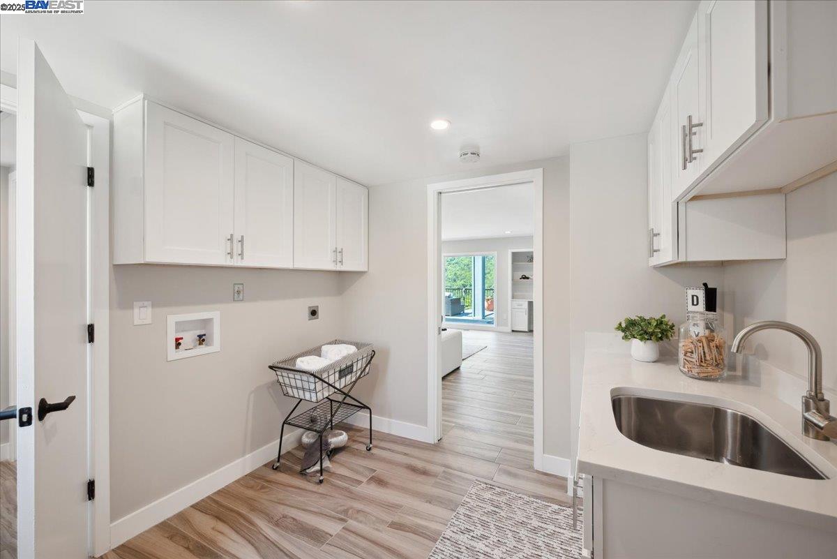 325 Bollinger Estates Court San Ramon, CA 94583 - Photo 23 of 59 a kitchen with a sink cabinets and wooden floor