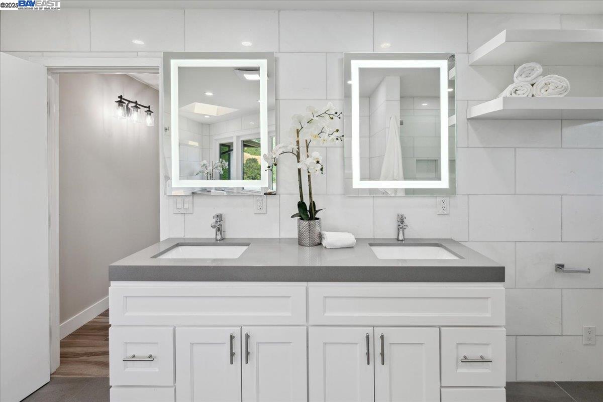 325 Bollinger Estates Court San Ramon, CA 94583 - Photo 30 of 59 a bathroom with a sink and a mirror