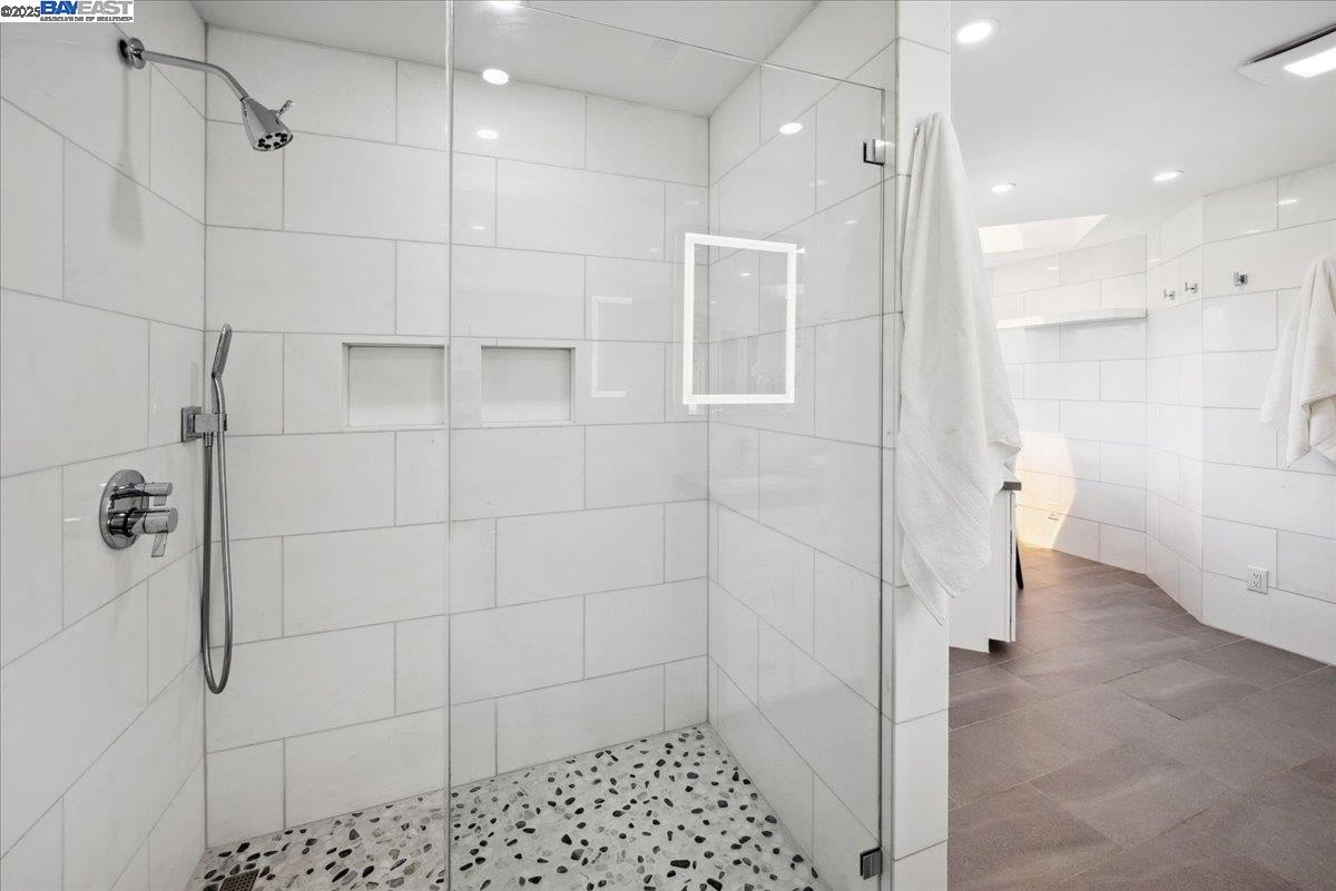 325 Bollinger Estates Court San Ramon, CA 94583 - Photo 33 of 59 a bathroom with a shower and a glass door