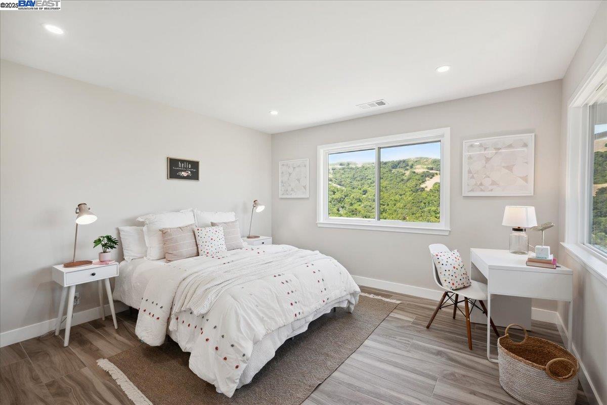 325 Bollinger Estates Court San Ramon, CA 94583 - Photo 37 of 59 a bedroom with a bed and a table