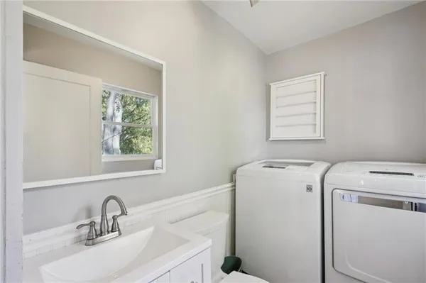 a view of storage and utility room with washer and dryer