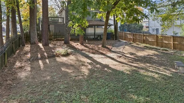 a backyard of a house with lots of green space