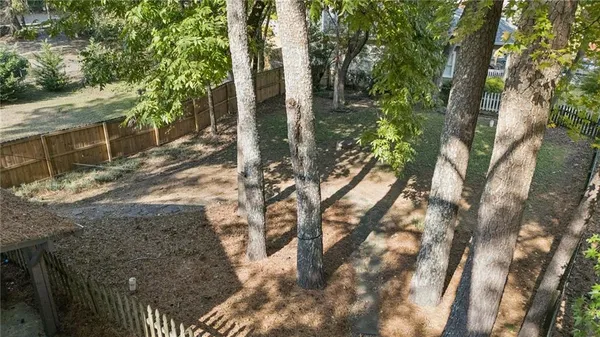 a backyard of a house with lots of green space