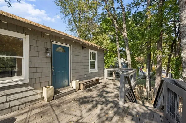 a view of house with outdoor seating area
