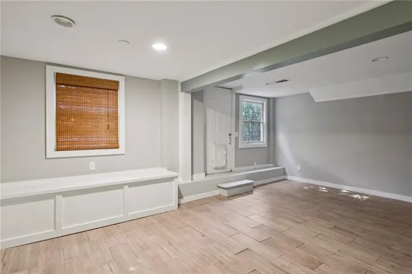 a view of an empty room with a window