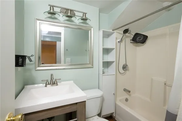 a bathroom with a sink vanity and a mirror