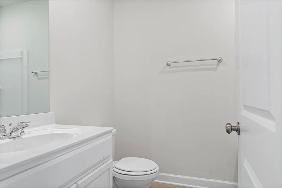 2456 Beverly Gail Road Pleasant View, TN 37146 - Photo 10 of 38 a bathroom with a granite countertop sink toilet and a mirror