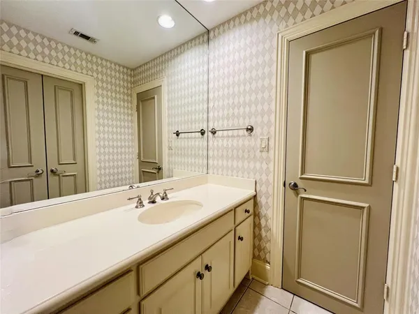 a bathroom with a sink double vanity and a mirror