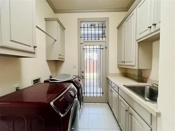 a kitchen that has a sink and a stove