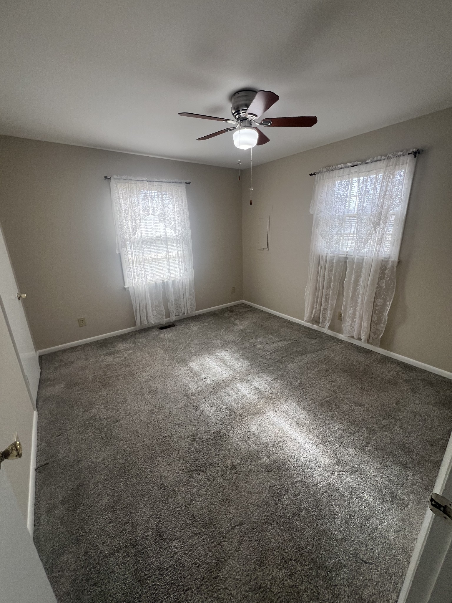 220 Apache Circle Pulaski, TN 38478 - Photo 14 of 25 a view of an empty room with window and chandelier fan