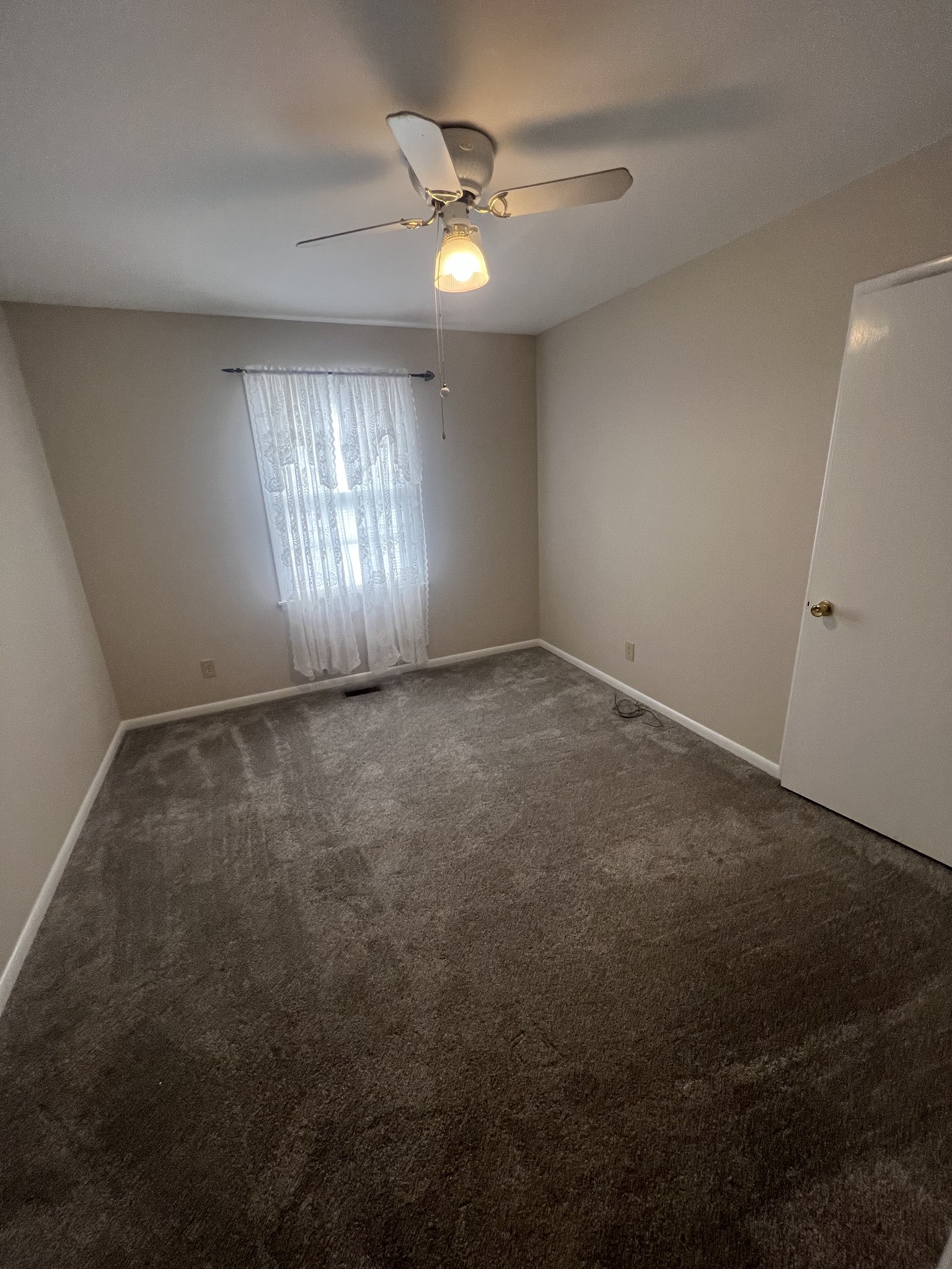 220 Apache Circle Pulaski, TN 38478 - Photo 17 of 25 an empty room with closet and windows