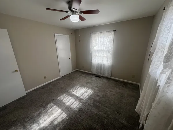 a view of an empty room and window