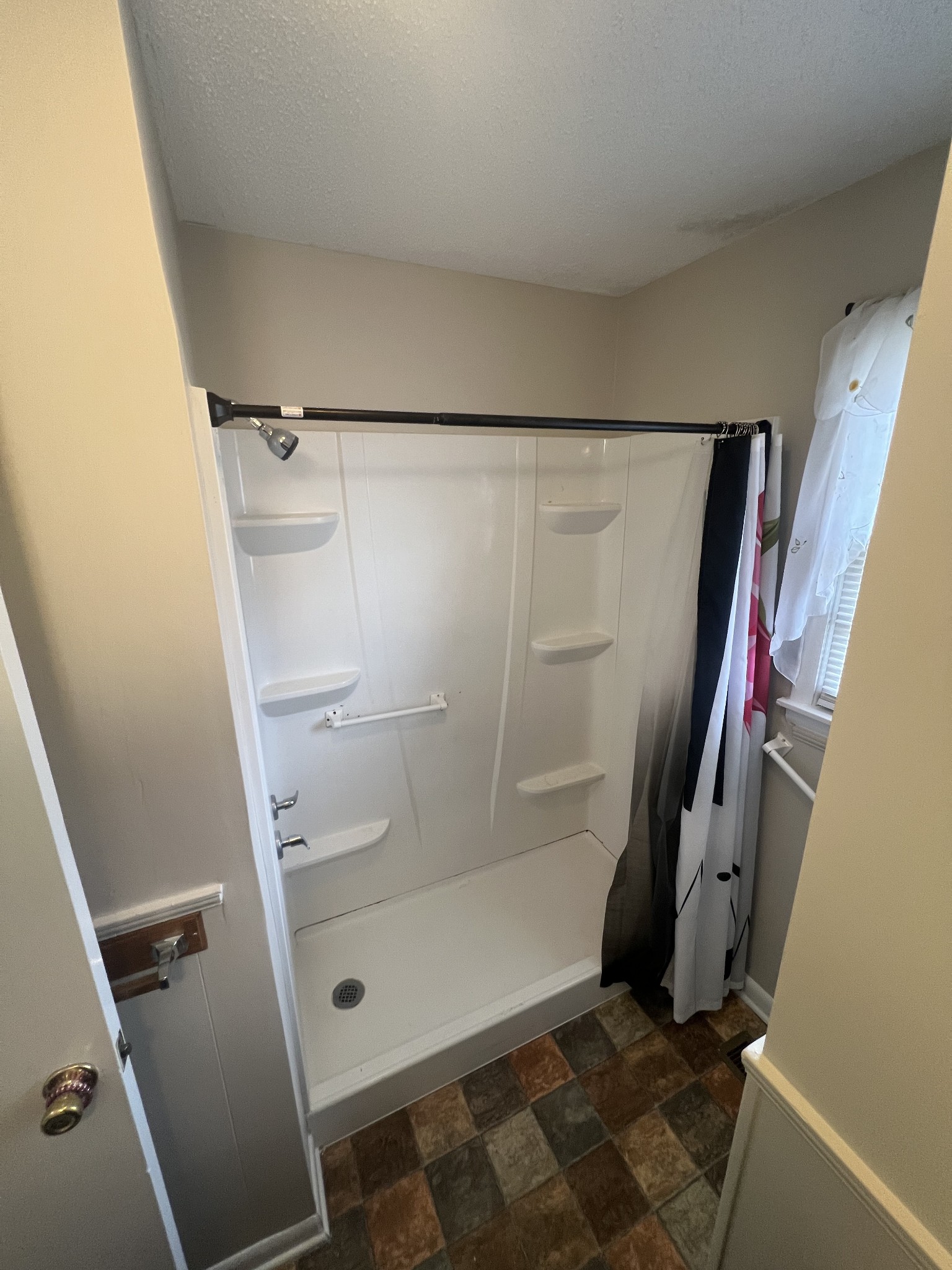 220 Apache Circle Pulaski, TN 38478 - Photo 19 of 25 a bathroom with a glass door shower and toilet