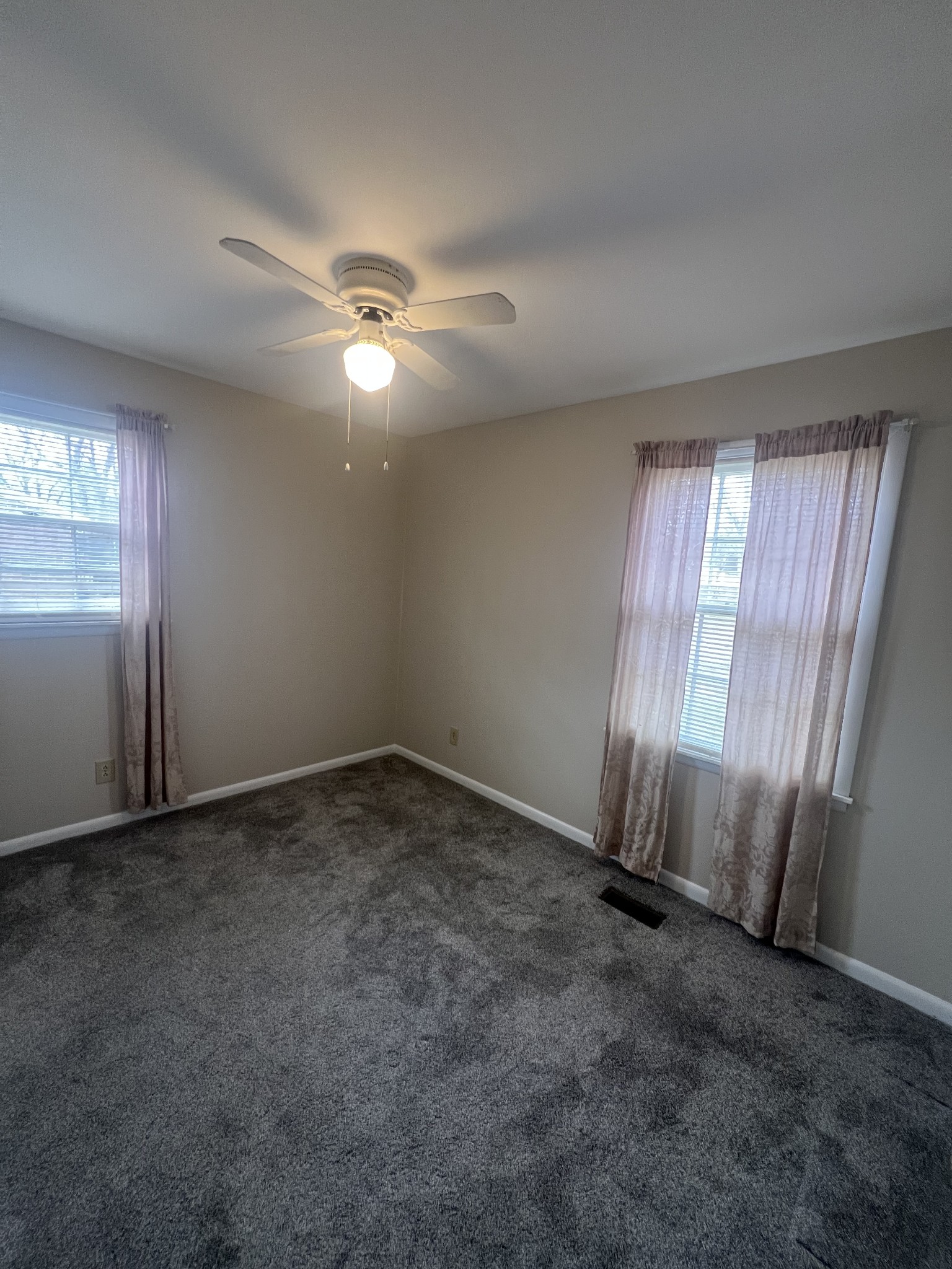 220 Apache Circle Pulaski, TN 38478 - Photo 21 of 25 an empty room with windows and fan