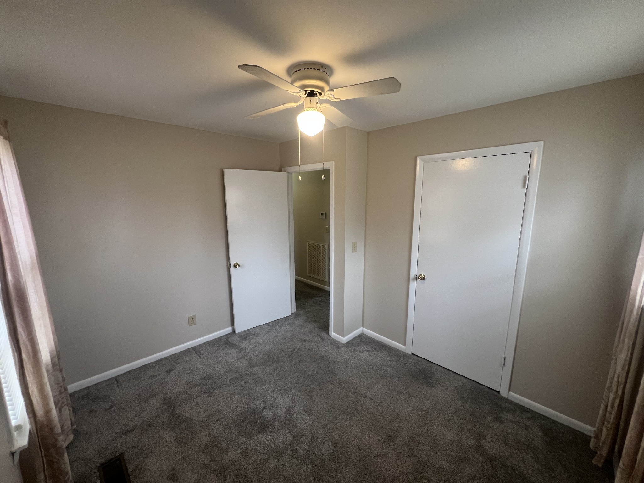 220 Apache Circle Pulaski, TN 38478 - Photo 22 of 25 an empty room with closet and a ceiling fan