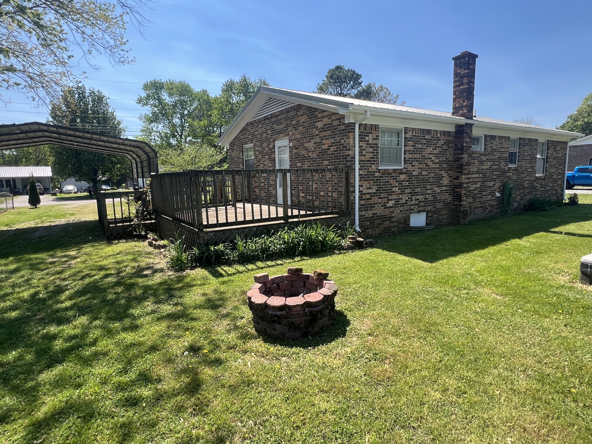 220 Apache Circle Pulaski, TN 38478 - Photo 25 of 25 a front view of a house with a garden and yard