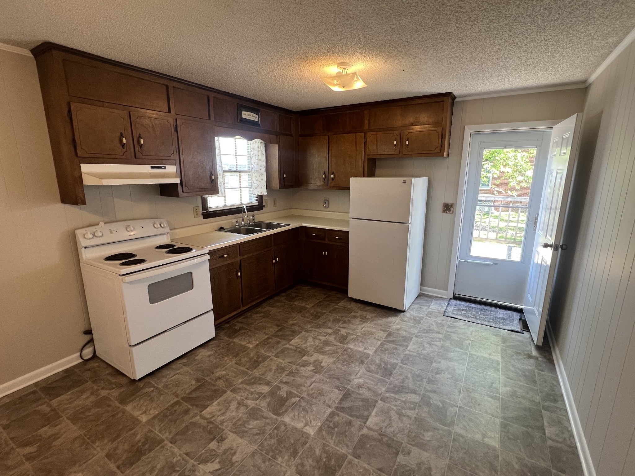 220 Apache Circle Pulaski, TN 38478 - Photo 10 of 25 a kitchen with stainless steel appliances a stove a sink and a refrigerator