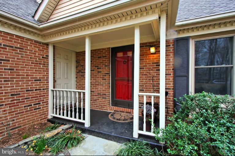 1874 Post Oak Trail Reston, VA 20191 - Photo 1 of 30 front view of a house with a porch