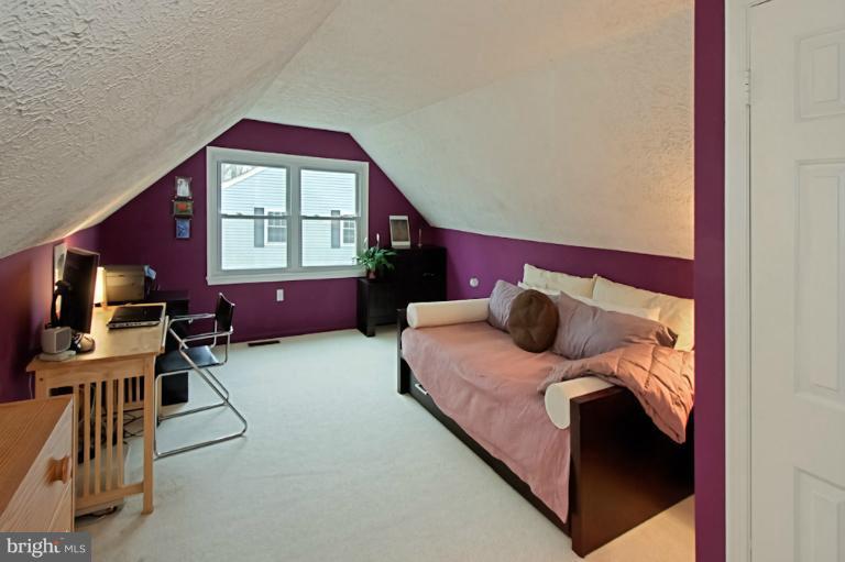 1874 Post Oak Trail Reston, VA 20191 - Photo 12 of 30 a bedroom with a bed and a window