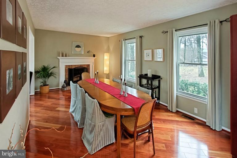 1874 Post Oak Trail Reston, VA 20191 - Photo 14 of 30 a dining room with furniture and wooden floor
