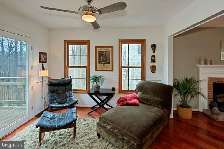 1874 Post Oak Trail Reston, VA 20191 - Photo 15 of 30 a living room with furniture and wooden floor