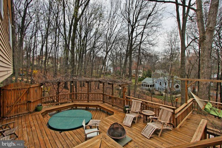 1874 Post Oak Trail Reston, VA 20191 - Photo 16 of 30 a view of a chairs and table on the wooden floor