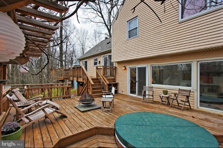 1874 Post Oak Trail Reston, VA 20191 - Photo 20 of 30 a view of a house with sitting area and furniture