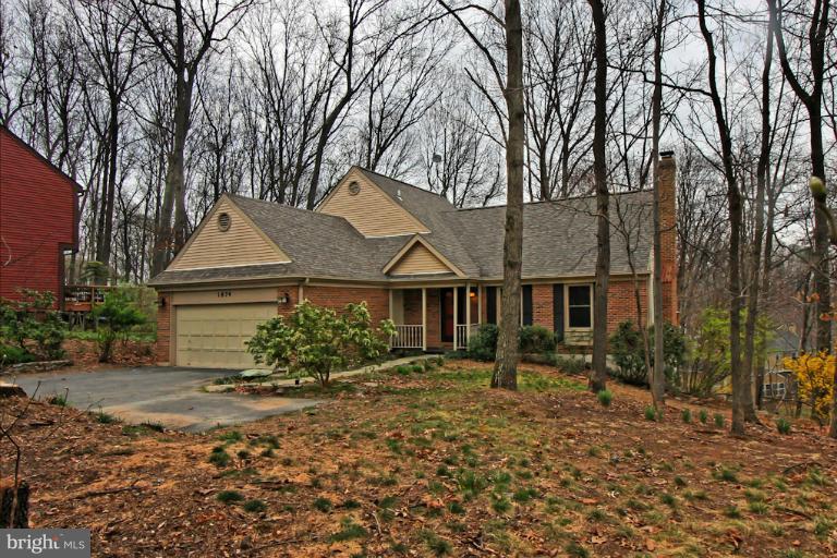 1874 Post Oak Trail Reston, VA 20191 - Photo 30 of 30 front view of a house with a yard
