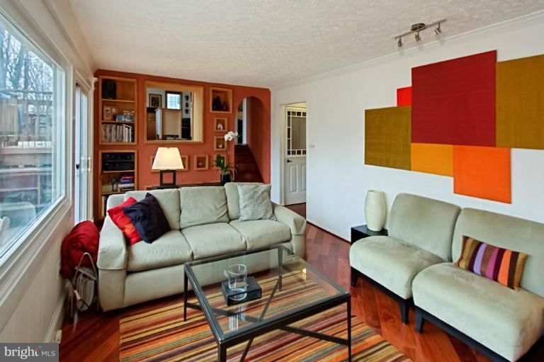 1874 Post Oak Trail Reston, VA 20191 - Photo 4 of 30 a living room with furniture and a window