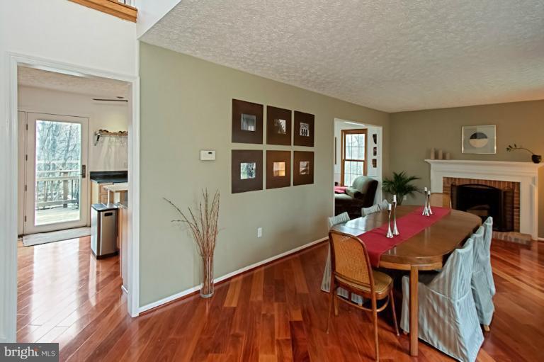 1874 Post Oak Trail Reston, VA 20191 - Photo 8 of 30 a view of a dining room with furniture and wooden floor