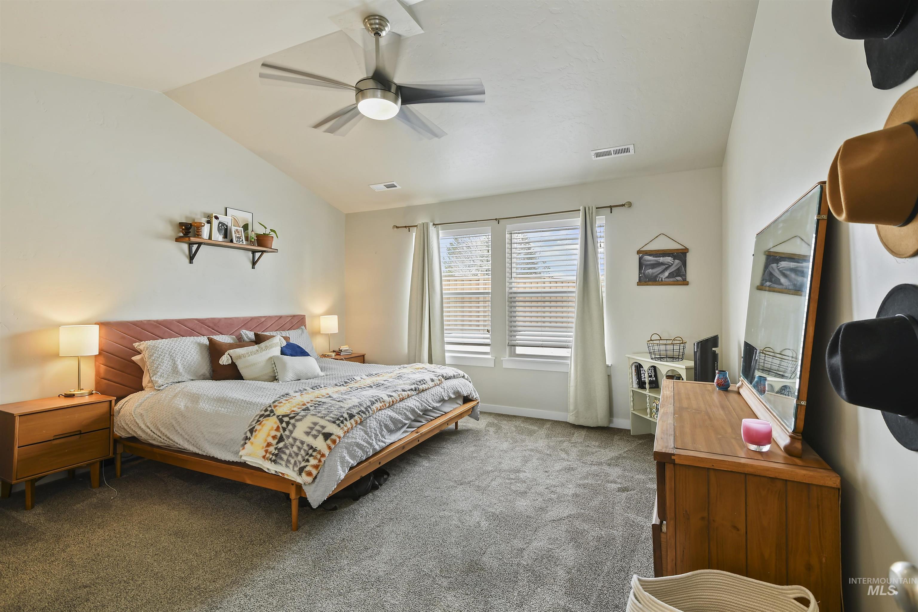 13472 Deodar Street Caldwell, ID 83607 - Photo 11 of 22 Bedroom featuring vaulted ceiling, a ceiling fan, and carpet floors