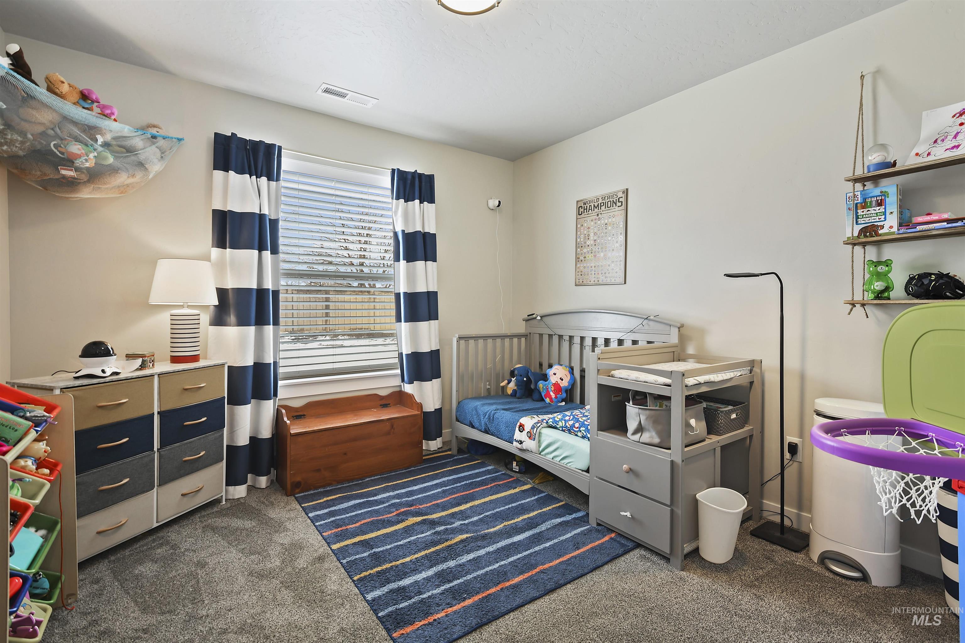 13472 Deodar Street Caldwell, ID 83607 - Photo 16 of 22 Bedroom with dark carpet