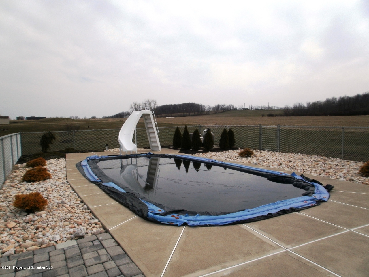340 Aberdeen Road Moscow, PA 18444 - Photo 26 of 32 a view of a swimming pool with a lake view