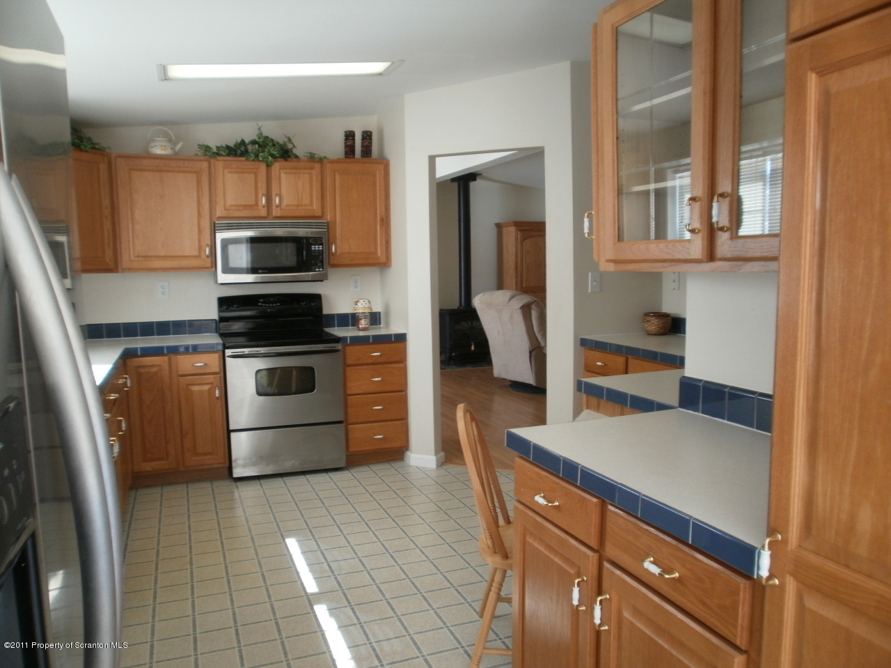340 Aberdeen Road Moscow, PA 18444 - Photo 5 of 32 a kitchen with stainless steel appliances a stove a sink and a refrigerator