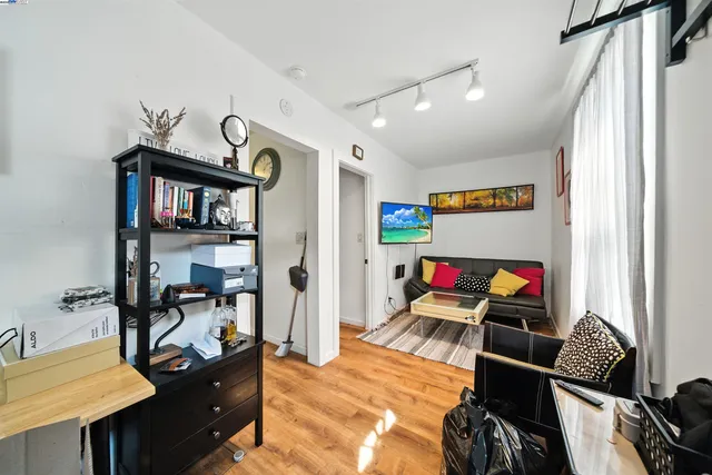 a room with furniture and a wooden floor