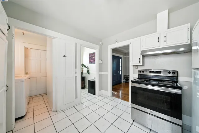a kitchen with cabinets and steel stainless steel appliances