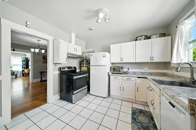 a kitchen with granite countertop cabinets and steel stainless steel appliances
