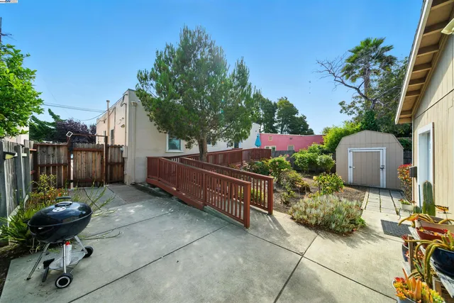 a backyard of a house with yard fire pit barbeque oven and outdoor seating