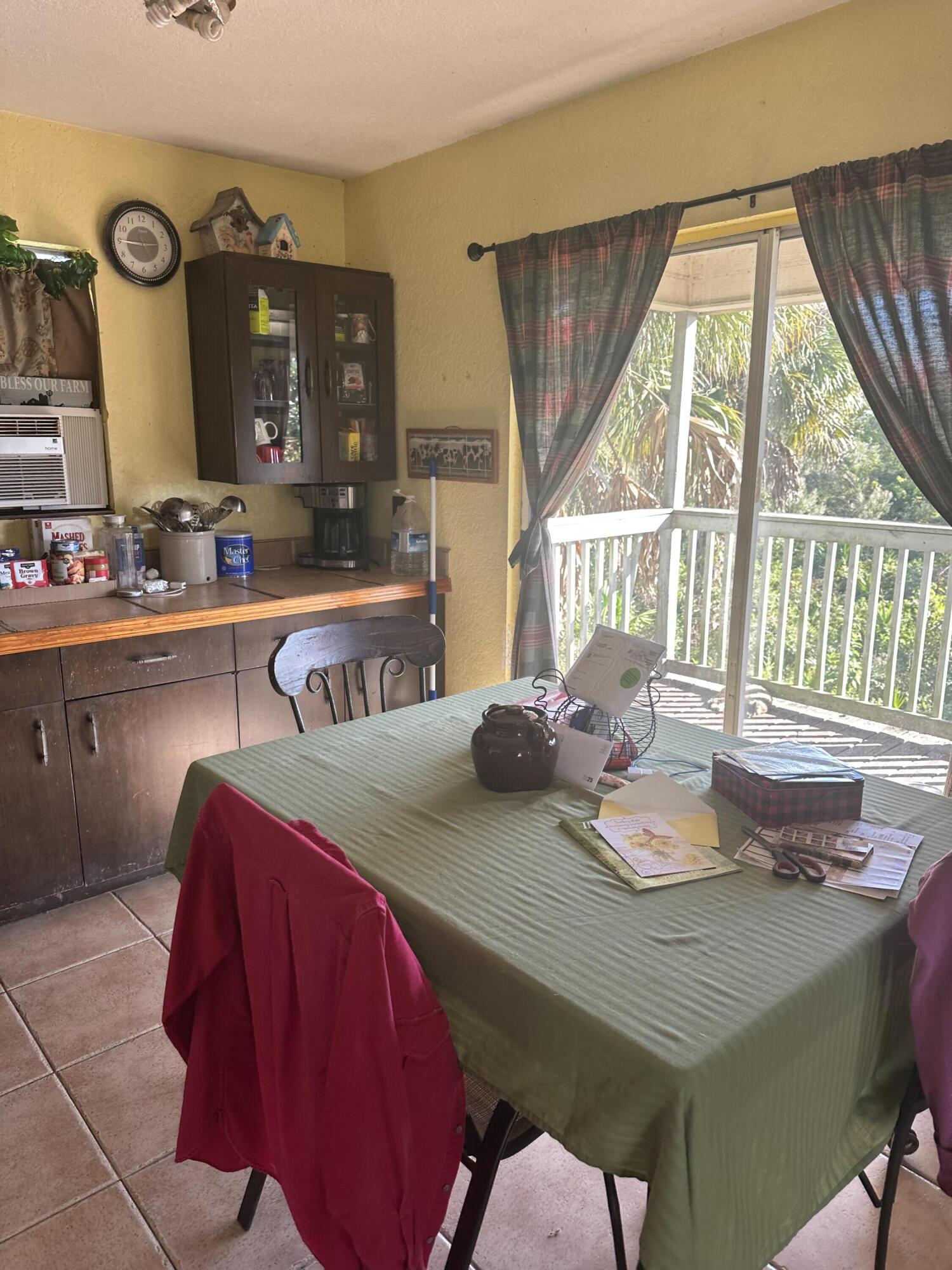 19632 Northwest 252nd Street Okeechobee, FL 34972 - Photo 4 of 11 a dinning table and chairs in a room