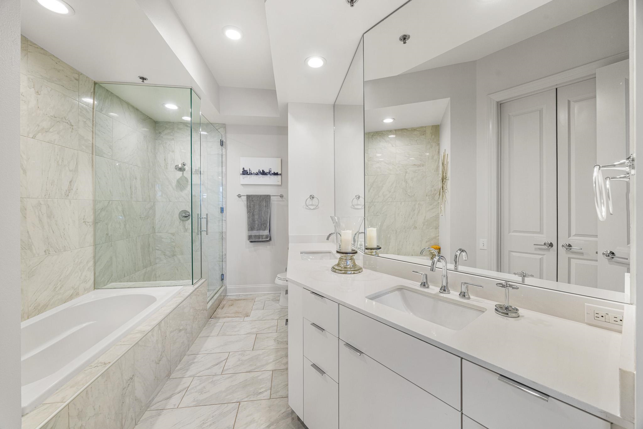 717 Riverside Drive, Unit 603 Memphis, TN 38103 - Photo 21 of 39 Soaking Tub with glass shower just beyond.