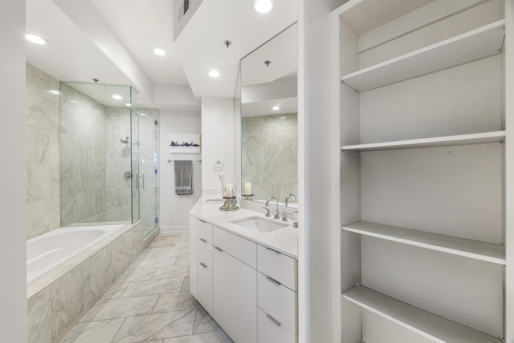 717 Riverside Drive, Unit 603 Memphis, TN 38103 - Photo 22 of 39 Open shelving for all the spa essentials.