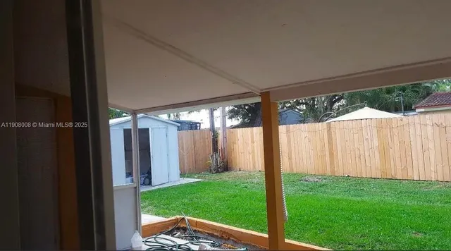 a view of a backyard with garden