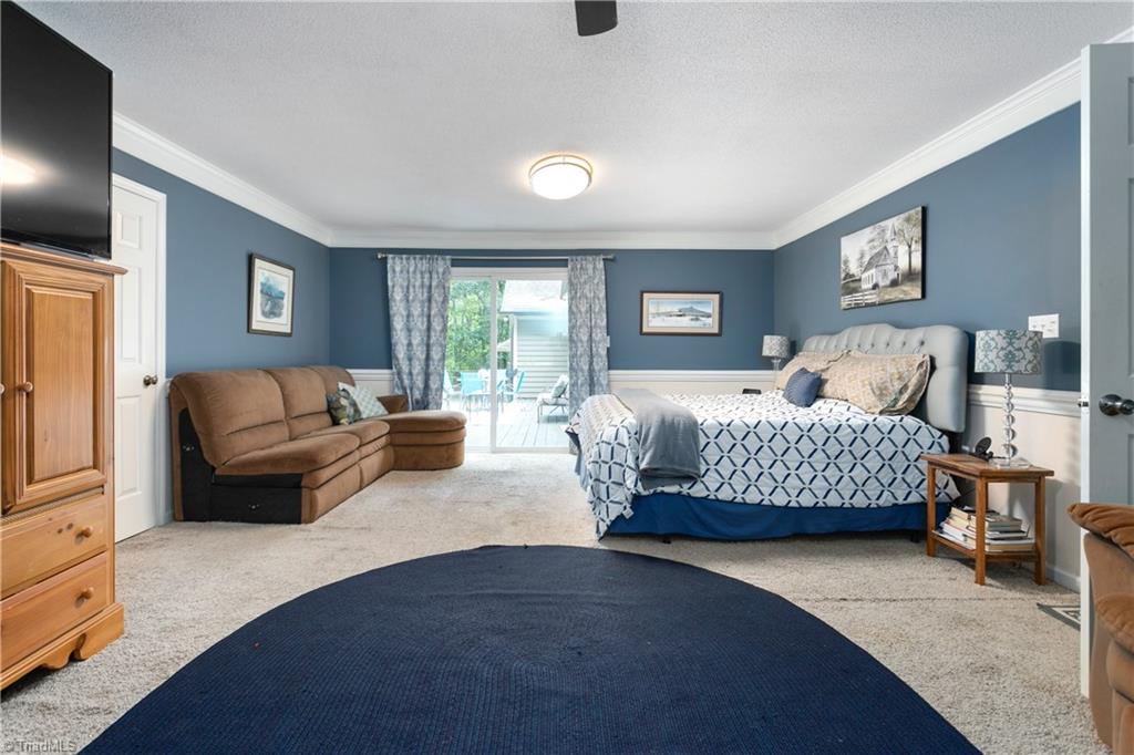 7405 Rader Court Climax, NC 27233 - Photo 26 of 37 Master Bedroom with access to Deck