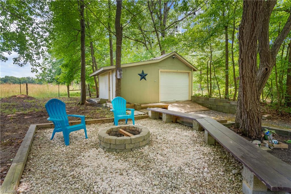 7405 Rader Court Climax, NC 27233 - Photo 33 of 37 Fire Pit with built in seating