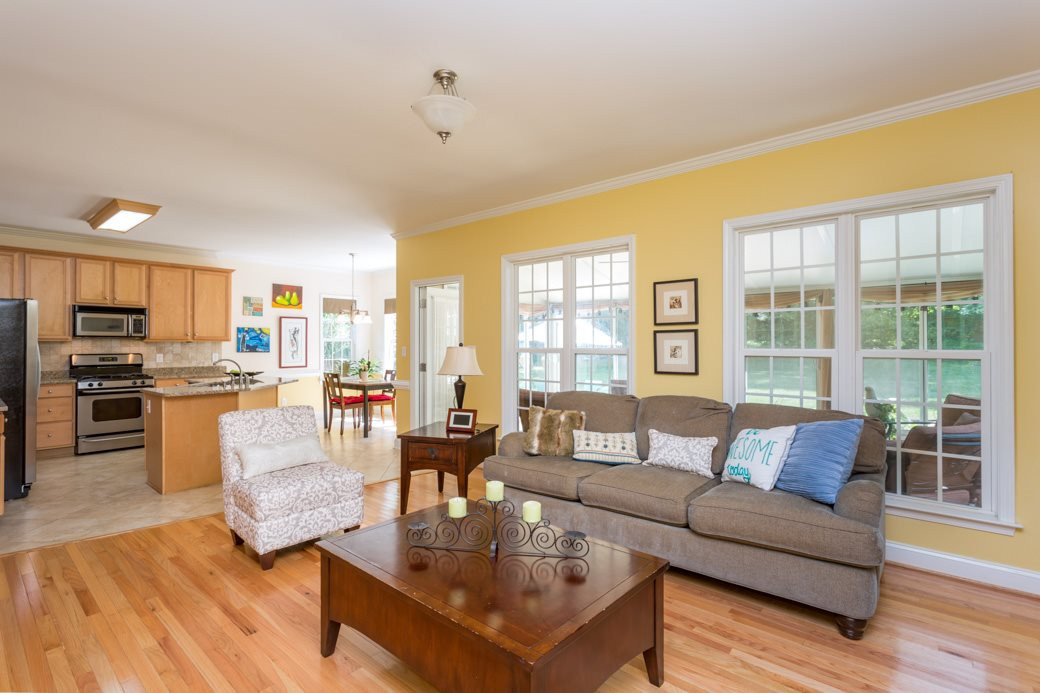 Another view of the family room that leads into the four seasons room and has a hidden closet for extra storage! Family Room