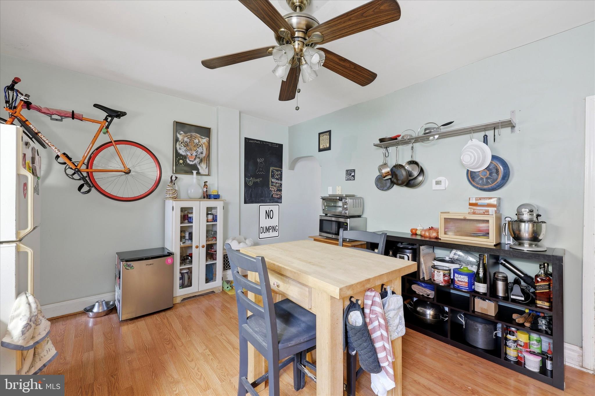 2442 East Gordon Street Philadelphia, PA 19125 - Photo 20 of 40 a view of a dining area with furniture and a clock